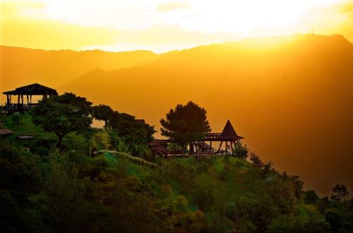 a view of a hill with the sun in the background at Shangrila Leisure Farm in Dongshan