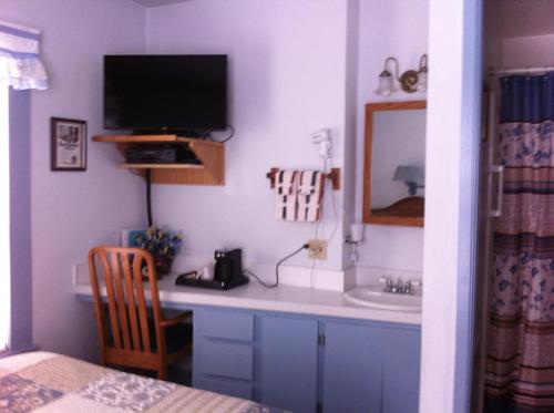 TV a/nebo společenská místnost v ubytování Pullman House Inn