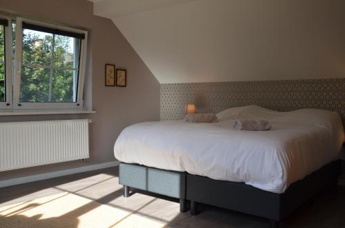 Säng eller sängar i ett rum på Cottage Marie-Henriette