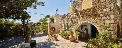 A garden outside Arolithos Traditional Village Hotel