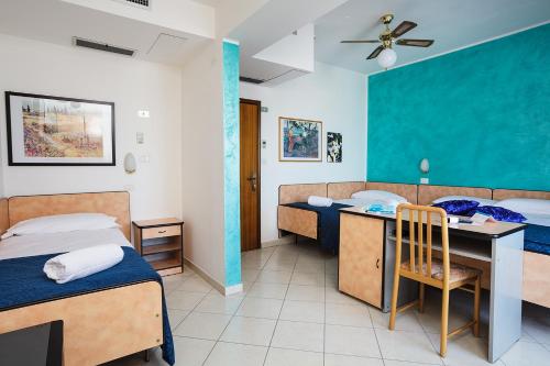 Postel nebo postele na pokoji v ubytování Hotel Albatros