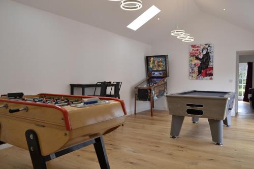 a living room with a pool table at Smithy House in Forfar