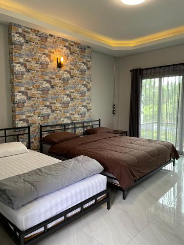 Un pat sau paturi într-o cameră la Re-Live Resort