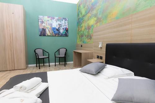 Säng eller sängar i ett rum på Mini Hotel Wf2 Caltagirone