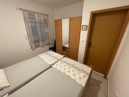 Ένα ή περισσότερα κρεβάτια σε δωμάτιο στο Apartements Delfin Vir