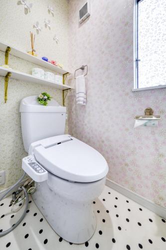 a bathroom with a white toilet in a room at Diamond Moon Palace Takadanobaba,2 stops to Shinjuku in Tokyo