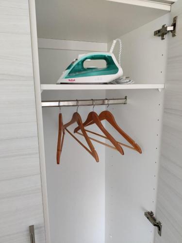 a closet with a shelf with a phone on it at Reipas in Kotka