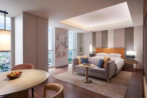Postel nebo postele na pokoji v ubytování Hyatt Regency Shanghai Jiading