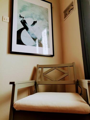 a bedroom with a bed and a picture on the wall at Country House in Sozopoli