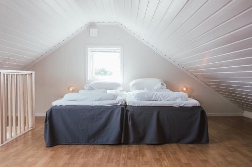 מיטה או מיטות בחדר ב-Dal Gjestegaard