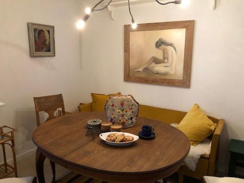 a dining room table with a bowl of food on it at Villa Kuriosa SKOGSFEEN in Ytterhogdal