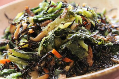 a bowl of food with broccoli and other vegetables at Kuretake Inn Gotemba Inter Gold Cabin in Gotemba
