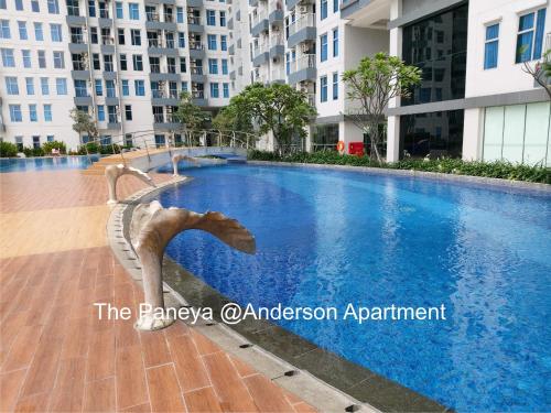 a swimming pool in the middle of a building at The Paneya@Anderson Apartment in Surabaya