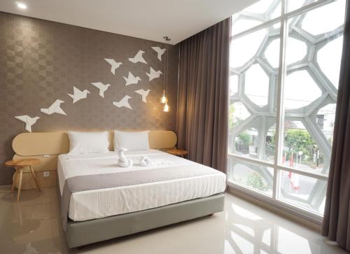 Ένα ή περισσότερα κρεβάτια σε δωμάτιο στο Nomaden Urban Stay