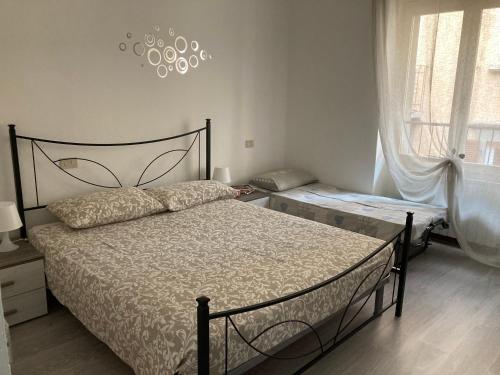 Posteľ alebo postele v izbe v ubytovaní Casa Mirella