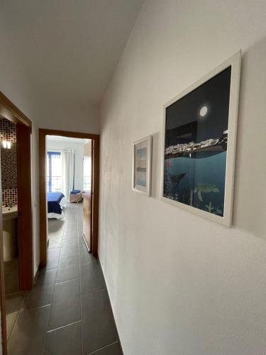 a hallway of a house with a painting on the wall at Casa del Castillo in El Cotillo