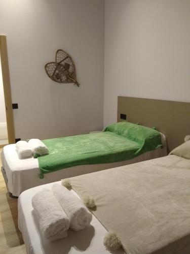 Postel nebo postele na pokoji v ubytování Apartamentos nuevos con encanto Fio de Neu