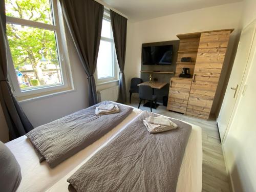 Postel nebo postele na pokoji v ubytování Hostel Harzer Hof