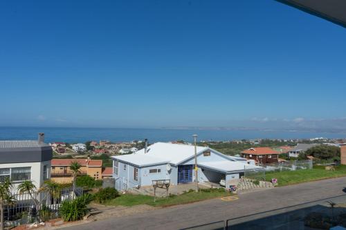 a view of the ocean from the balcony of a house at Blue Star Villa in Tergniet