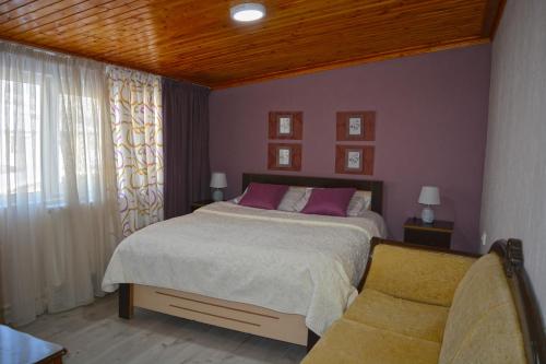 Un ou plusieurs lits dans un hébergement de l'établissement Guesthouse of Manoni Ratiani