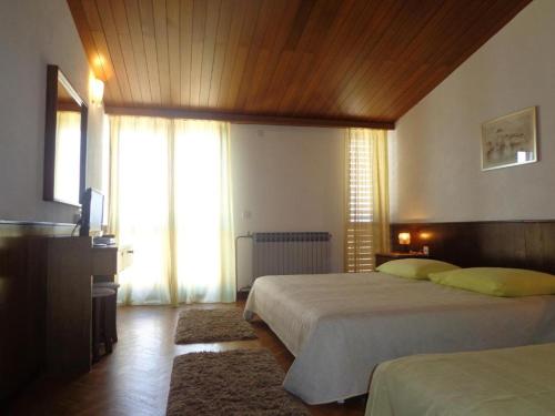 Ένα ή περισσότερα κρεβάτια σε δωμάτιο στο Guesthouse Matko