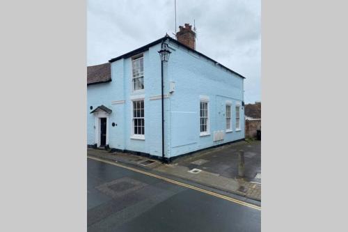 a blue building on the side of a street at City Centre Entire Studio Apartment in Chichester