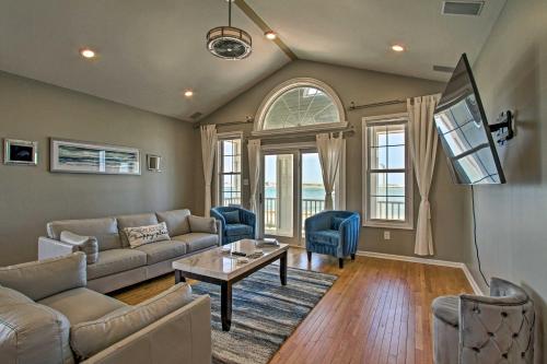 a living room with a couch and a table at Idyllic Oceanfront Home on Atlantic City Boardwalk in Atlantic City