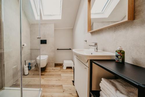 a bathroom with a sink and a shower at Sun House in Nadole