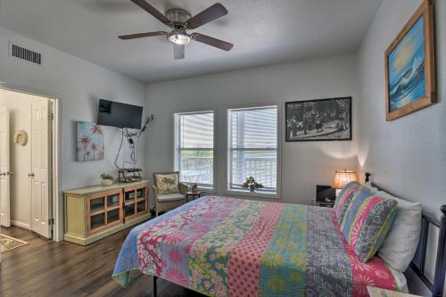a bedroom with a bed and a ceiling fan at Bayfront Fishing Pier Galveston Island Home! in Galveston