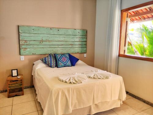 Ένα ή περισσότερα κρεβάτια σε δωμάτιο στο Pousada Villa Magna - Chalé