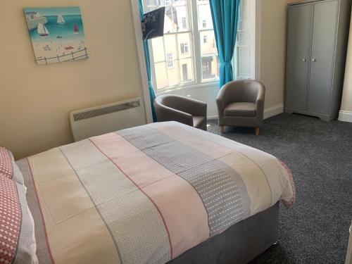 Ένα ή περισσότερα κρεβάτια σε δωμάτιο στο Letchworth Guest House