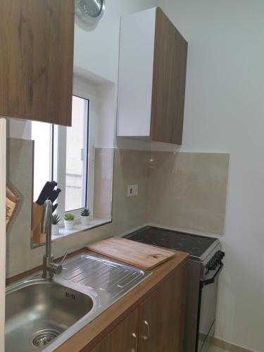 A kitchen or kitchenette at Modern Apartment in Central Bugibba