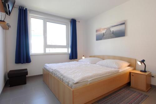 Postel nebo postele na pokoji v ubytování Residenz am Strand Wohnung 4-59
