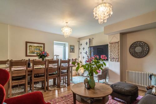 a living room with a dining room and a dining table at House close to kings cross in London