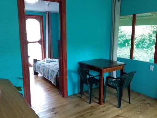 a bedroom with a desk and a bed and a mirror at Drake Lapas in Drake