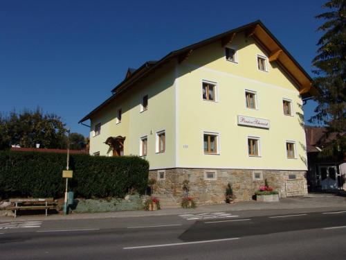 a large white building on the side of a street at Pension Scherwirt in Graz