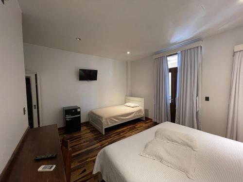 Кровать или кровати в номере Patio del Puerto Hotel Boutique