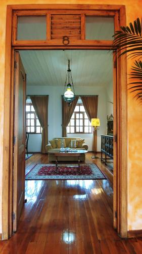 a living room with a couch and a table at Hotel Boutique Casa Montalvo Cuenca in Cuenca