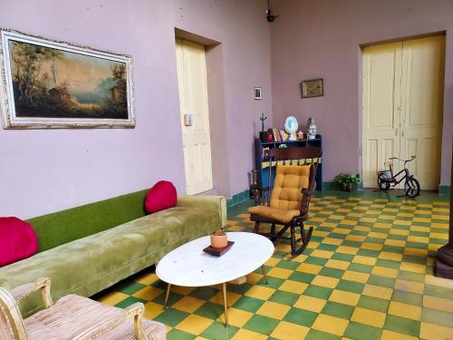 a living room with a couch and a table at Hotel Brunette in Santa Ana
