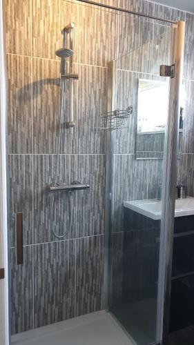 a bathroom with a shower with a glass door at Holiday Apartment, Balloch, Loch Lomond in Balloch