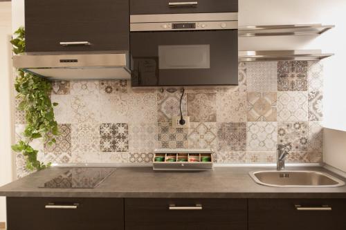 Kjøkken eller kjøkkenkrok på Popolo & Flaminio Rooms