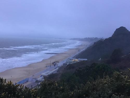a view of a beach and the ocean at Rockmount Court in Bournemouth