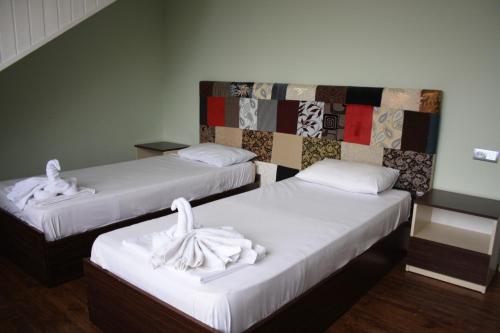 Ένα ή περισσότερα κρεβάτια σε δωμάτιο στο Gabala Explorers' Villa near Tufandag