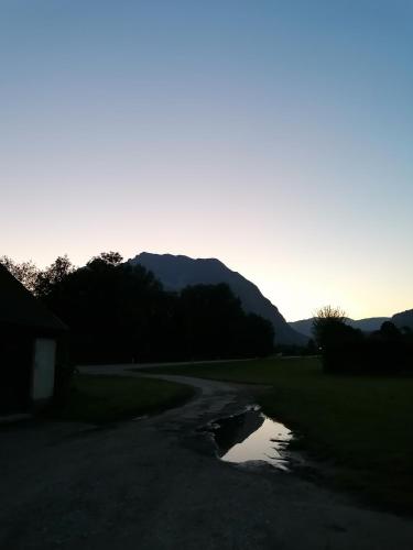 a puddle of water on the side of a road at Amtmannhaus Ferienunterkunft in Irdning