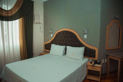 Katil atau katil-katil dalam bilik di Hotel Meri Conselheiro Lafaiete
