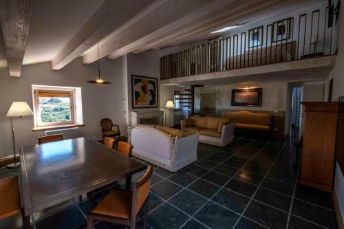 a living room with a couch and a table at RESIDENZA BALIOS in Vaglio di Basilicata