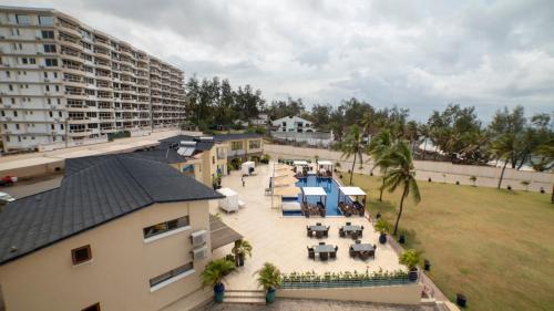 an overhead view of a building with tables and chairs at Jumeirah Beachfront in Mombasa