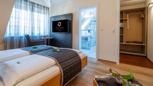 Katil atau katil-katil dalam bilik di Boutiquehotel zur Winzerstube - Adults Only
