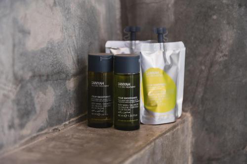two bottles of hair products sitting on a shelf at Casa di Melo - Organic Country Hotel in Cassibile