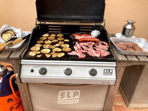a stove with a bunch of different types of food on it at 4 persoons bungalow met gemeenschappelijk zwembad in Teulada